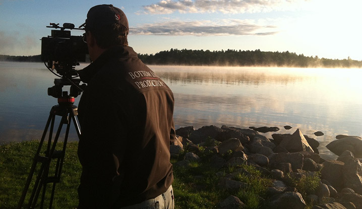 Bottom Line photographer filming nature scene